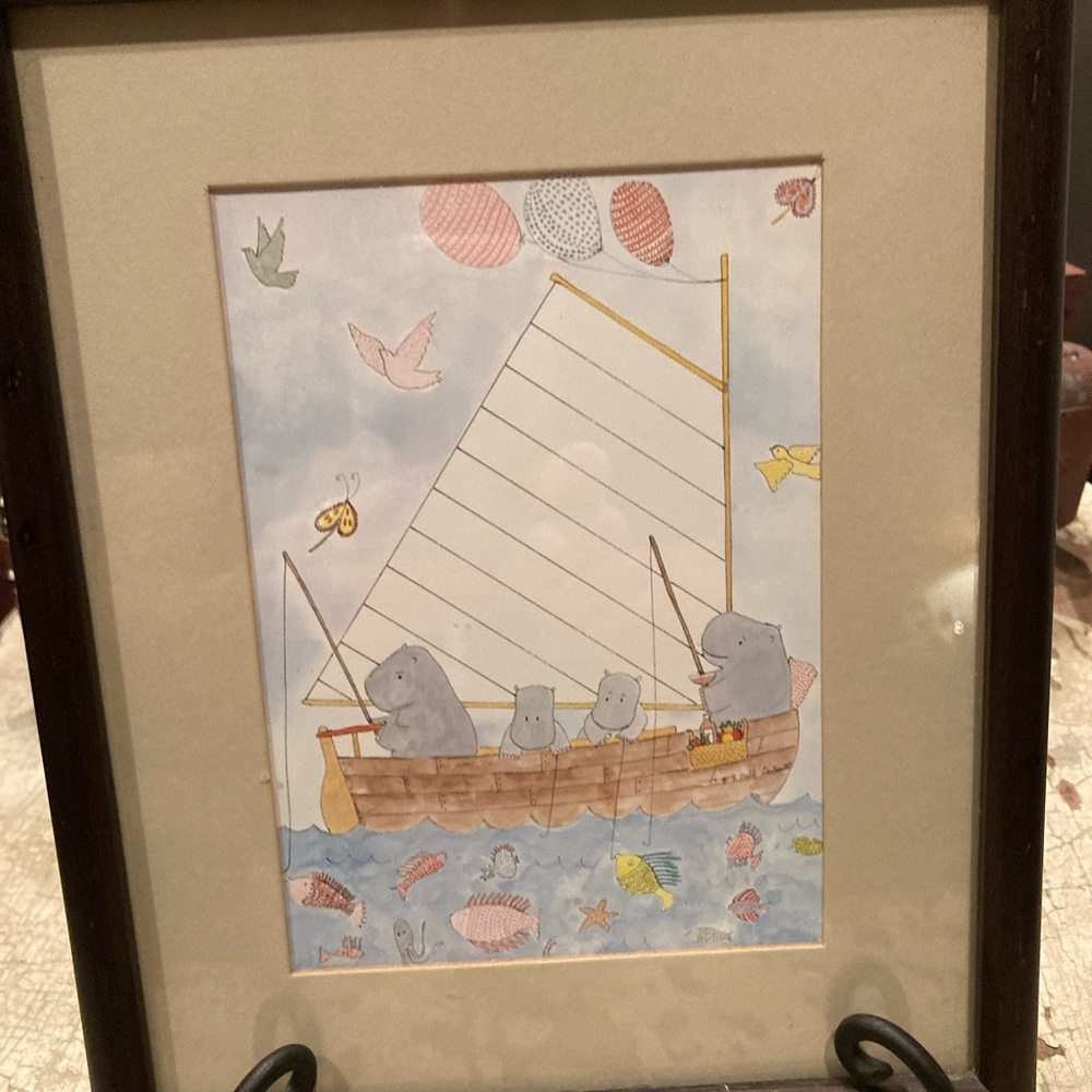 Cute framed child like picture of hippos fishing.